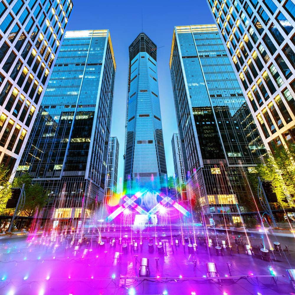 A vibrant city skyline with iconic landmarks and bustling streets, showcasing urban energy and charm